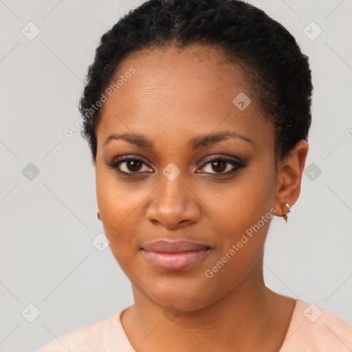 Joyful black young-adult female with short  brown hair and brown eyes