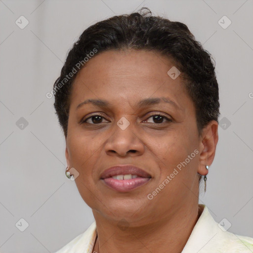 Joyful latino adult female with short  brown hair and brown eyes