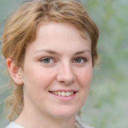 Joyful white young-adult female with medium  brown hair and green eyes