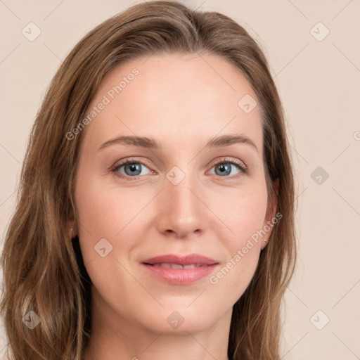 Joyful white young-adult female with long  brown hair and green eyes