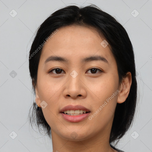 Joyful asian young-adult female with medium  brown hair and brown eyes