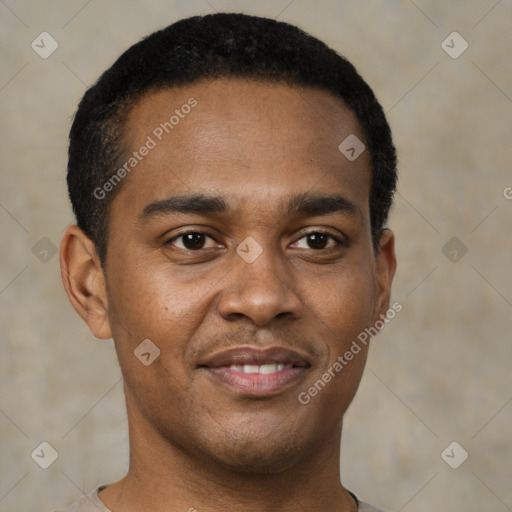 Joyful black young-adult male with short  brown hair and brown eyes