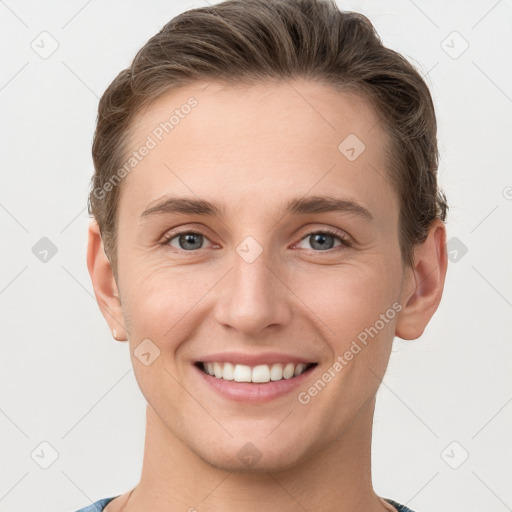 Joyful white young-adult female with short  brown hair and grey eyes