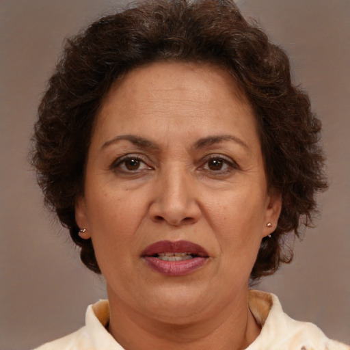 Joyful white adult female with short  brown hair and brown eyes