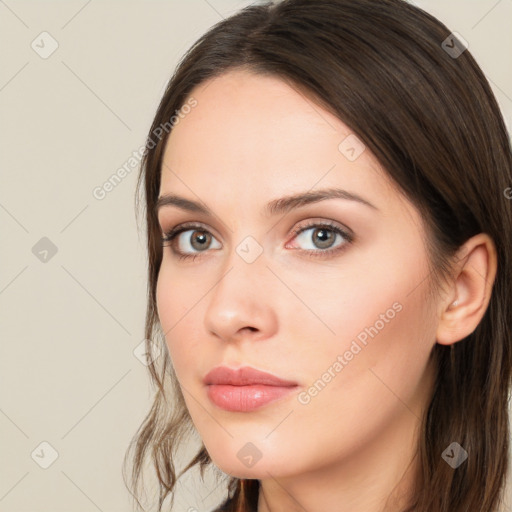 Neutral white young-adult female with long  brown hair and brown eyes