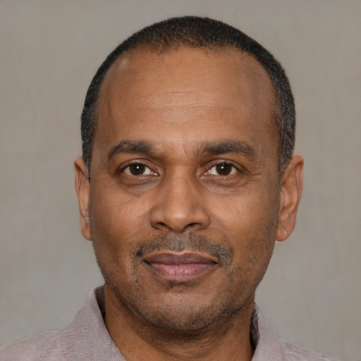 Neutral latino adult male with short  black hair and brown eyes