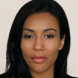 Joyful latino young-adult female with long  black hair and brown eyes