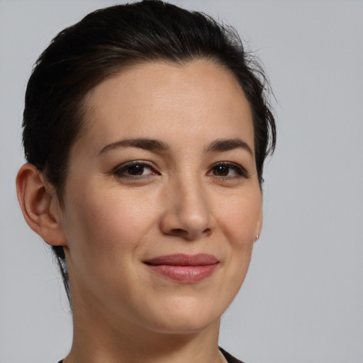 Joyful white young-adult female with medium  brown hair and brown eyes