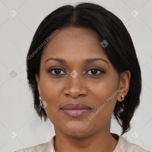 Joyful black adult female with medium  black hair and brown eyes