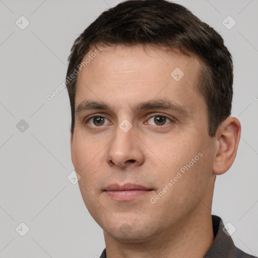 Joyful white young-adult male with short  brown hair and brown eyes