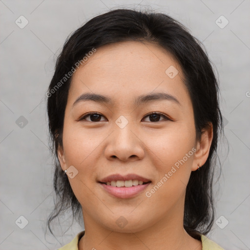 Joyful asian young-adult female with medium  brown hair and brown eyes