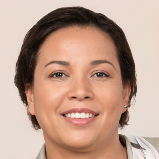 Joyful white young-adult female with medium  brown hair and brown eyes