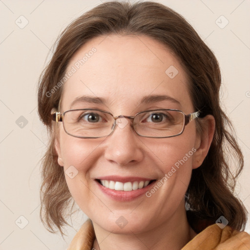 Joyful white adult female with medium  brown hair and blue eyes