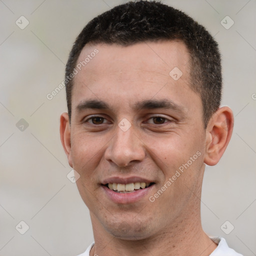 Joyful white young-adult male with short  brown hair and brown eyes