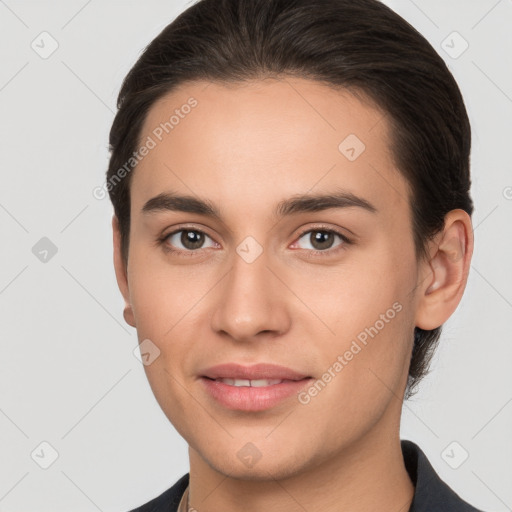 Joyful white young-adult female with short  brown hair and brown eyes