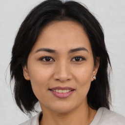 Joyful asian young-adult female with medium  brown hair and brown eyes