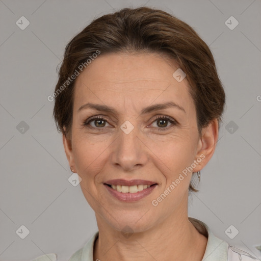 Joyful white adult female with short  brown hair and brown eyes