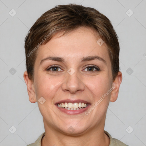 Joyful white young-adult female with short  brown hair and grey eyes