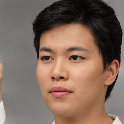 Neutral asian young-adult male with short  brown hair and brown eyes