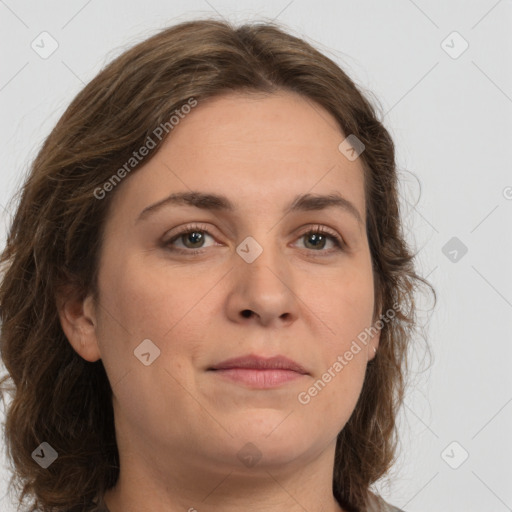 Joyful white young-adult female with long  brown hair and green eyes