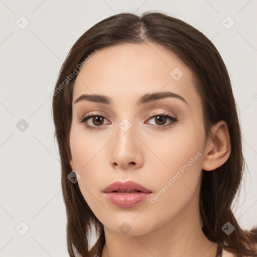 Neutral white young-adult female with long  brown hair and brown eyes