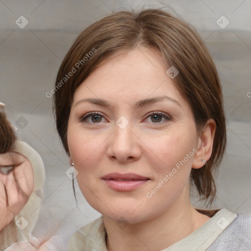 Joyful white young-adult female with medium  brown hair and blue eyes