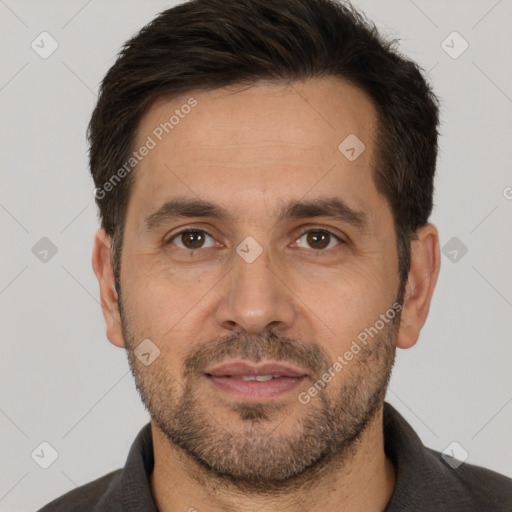 Joyful white adult male with short  brown hair and brown eyes