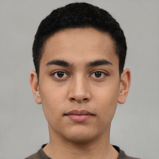 Neutral latino young-adult male with short  black hair and brown eyes