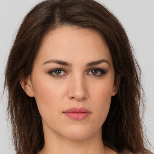 Neutral white young-adult female with long  brown hair and brown eyes