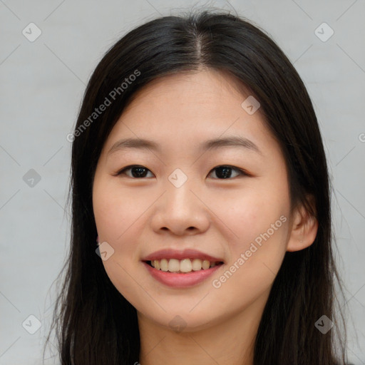 Joyful asian young-adult female with long  brown hair and brown eyes