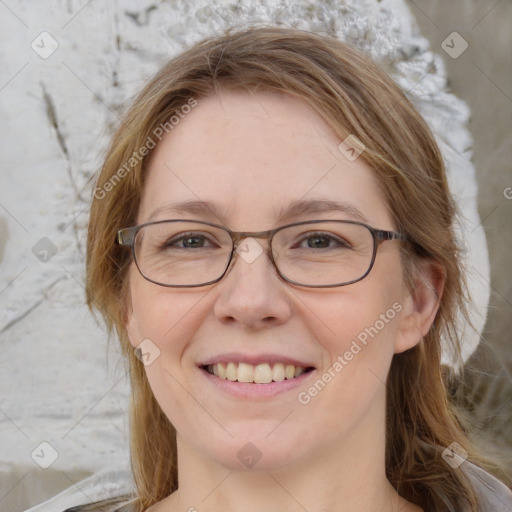 Joyful white adult female with medium  brown hair and blue eyes