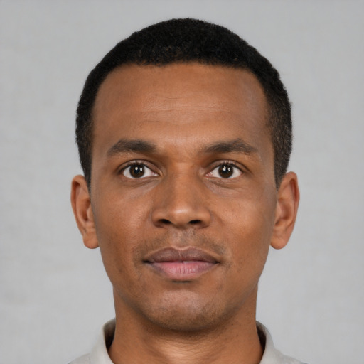 Neutral black young-adult male with short  black hair and brown eyes