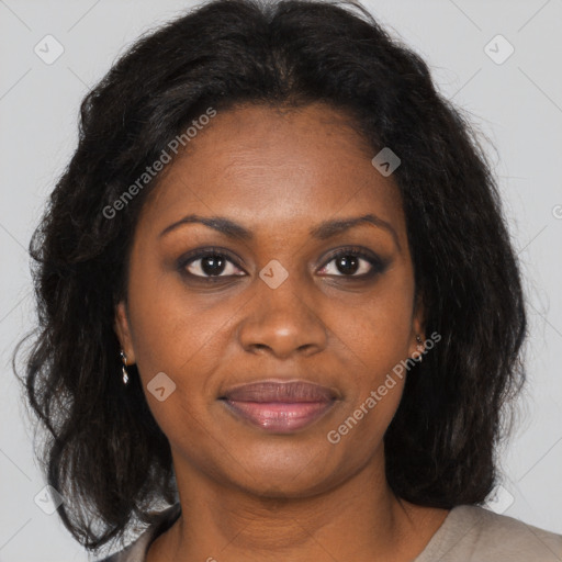 Joyful black adult female with medium  brown hair and brown eyes