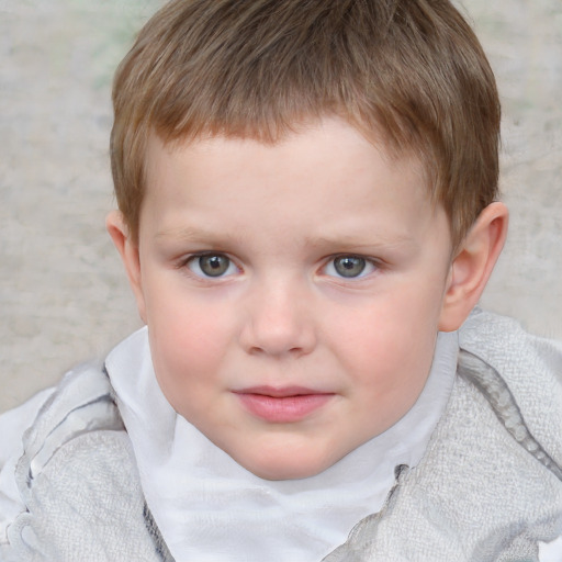 Joyful white child male with short  brown hair and blue eyes