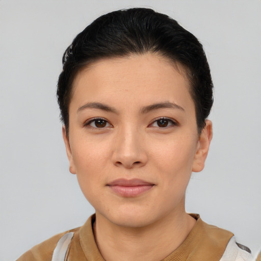 Joyful asian young-adult female with short  brown hair and brown eyes
