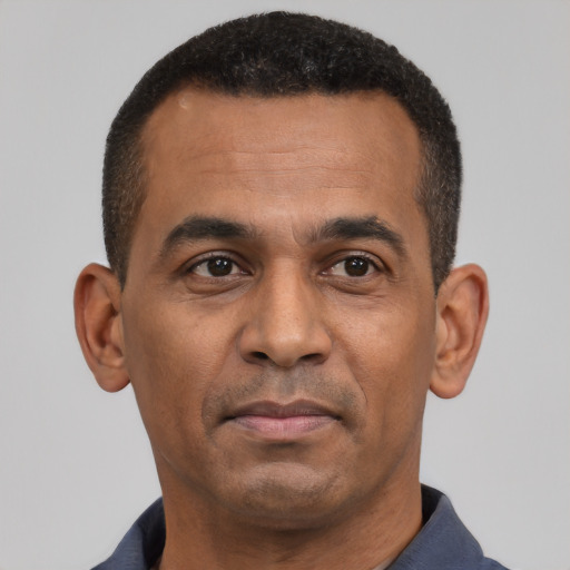 Neutral latino adult male with short  black hair and brown eyes
