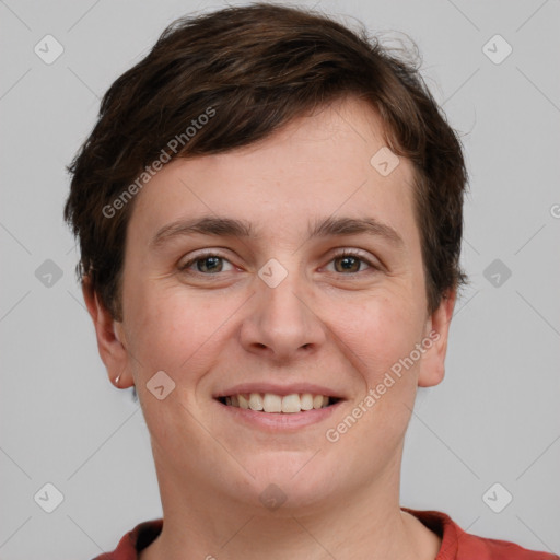 Joyful white young-adult female with short  brown hair and grey eyes