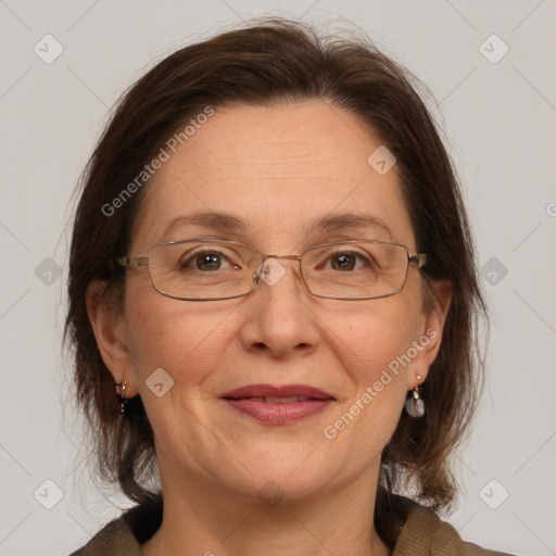 Joyful white adult female with medium  brown hair and brown eyes