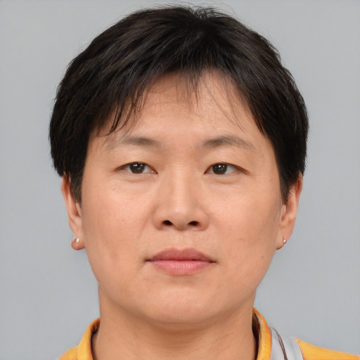Neutral asian adult female with short  brown hair and brown eyes