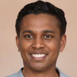 Joyful latino young-adult male with short  black hair and brown eyes