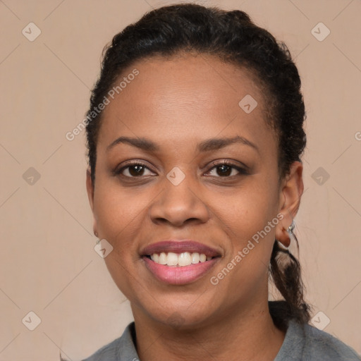 Joyful black young-adult female with short  brown hair and brown eyes