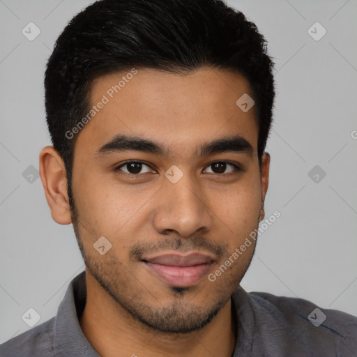 Joyful latino young-adult male with short  brown hair and brown eyes