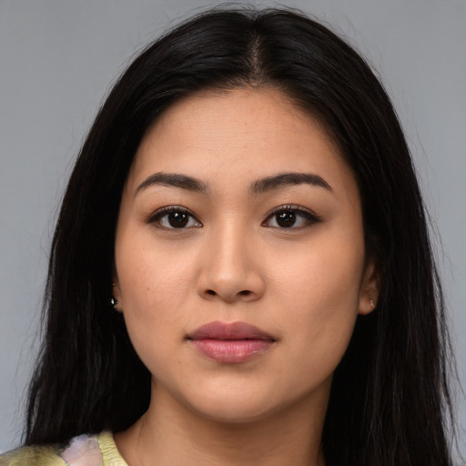 Neutral latino young-adult female with long  brown hair and brown eyes