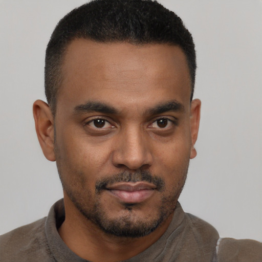 Neutral black young-adult male with short  black hair and brown eyes