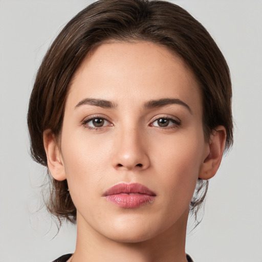 Neutral white young-adult female with medium  brown hair and brown eyes