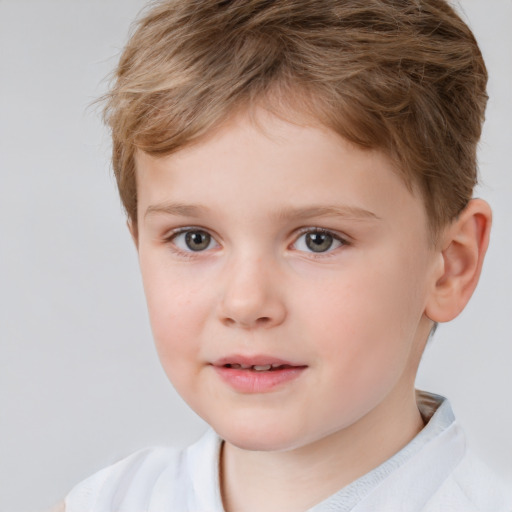 Joyful white child male with short  brown hair and brown eyes