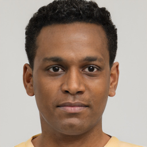 Neutral black young-adult male with short  black hair and brown eyes
