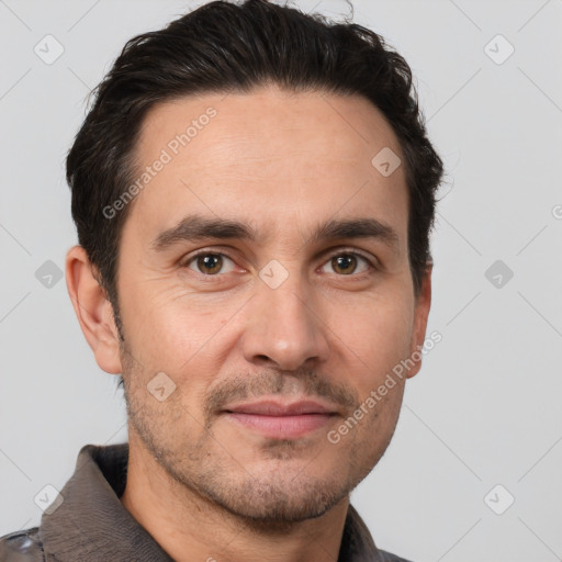 Joyful white adult male with short  brown hair and brown eyes