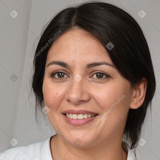 Joyful white adult female with medium  brown hair and brown eyes