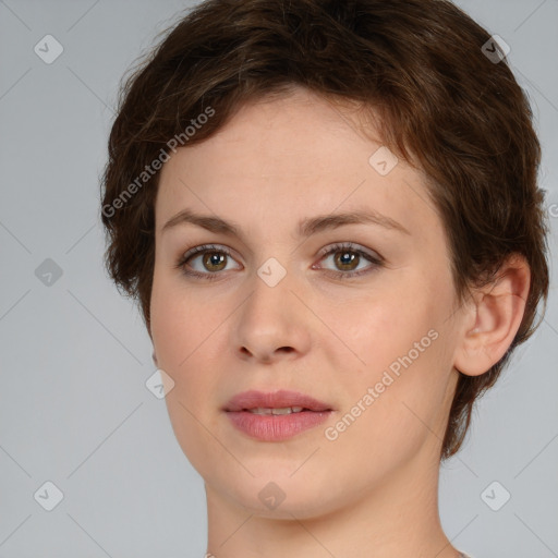 Joyful white young-adult female with short  brown hair and green eyes